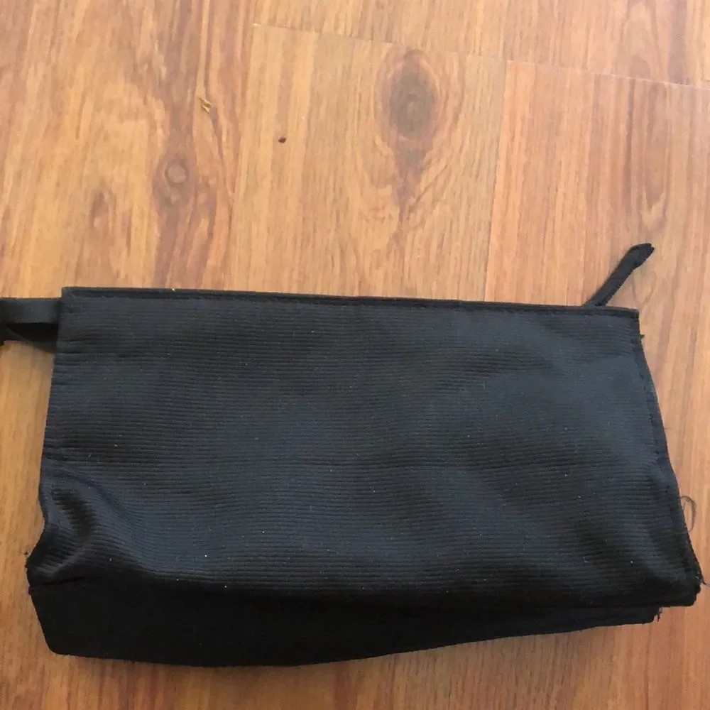 MAC Cosmetics black and purple bag.